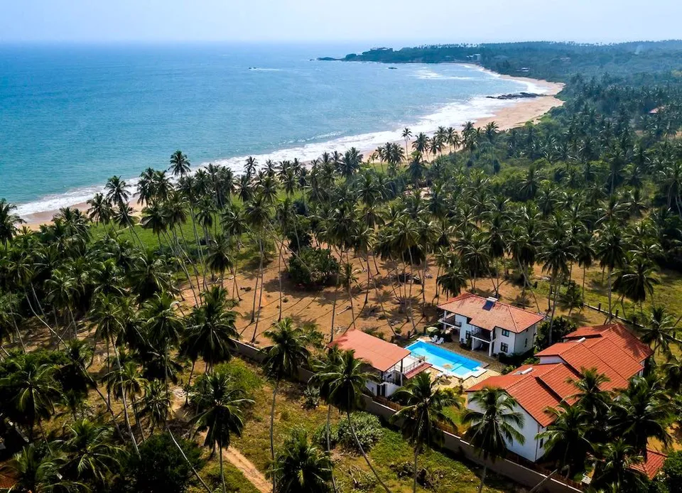 Bird's eye view of Green Parrot Beach Resort between the lagoon and the ocean